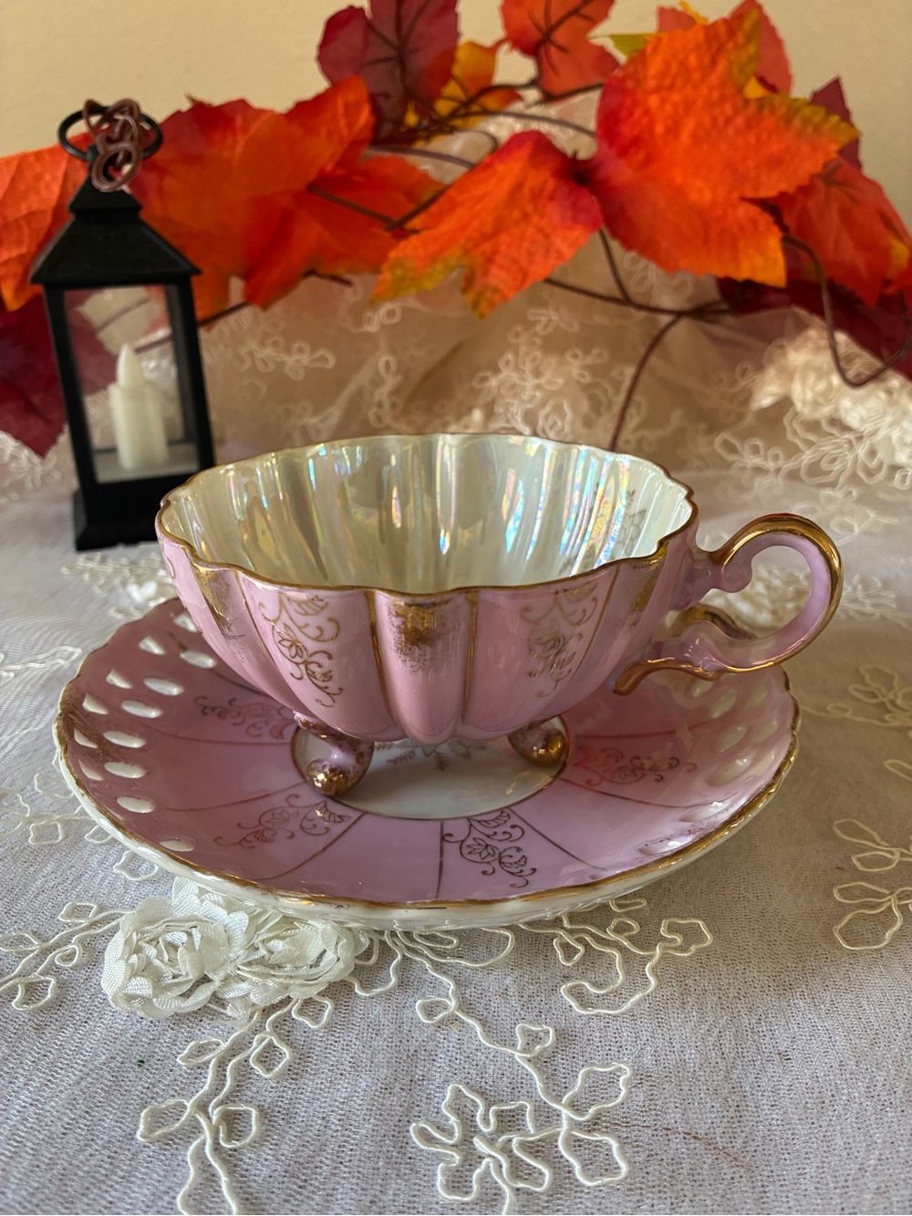 Elegant Pink Pearlized Porcelain Teacup and Saucer Set with Gold Trim
